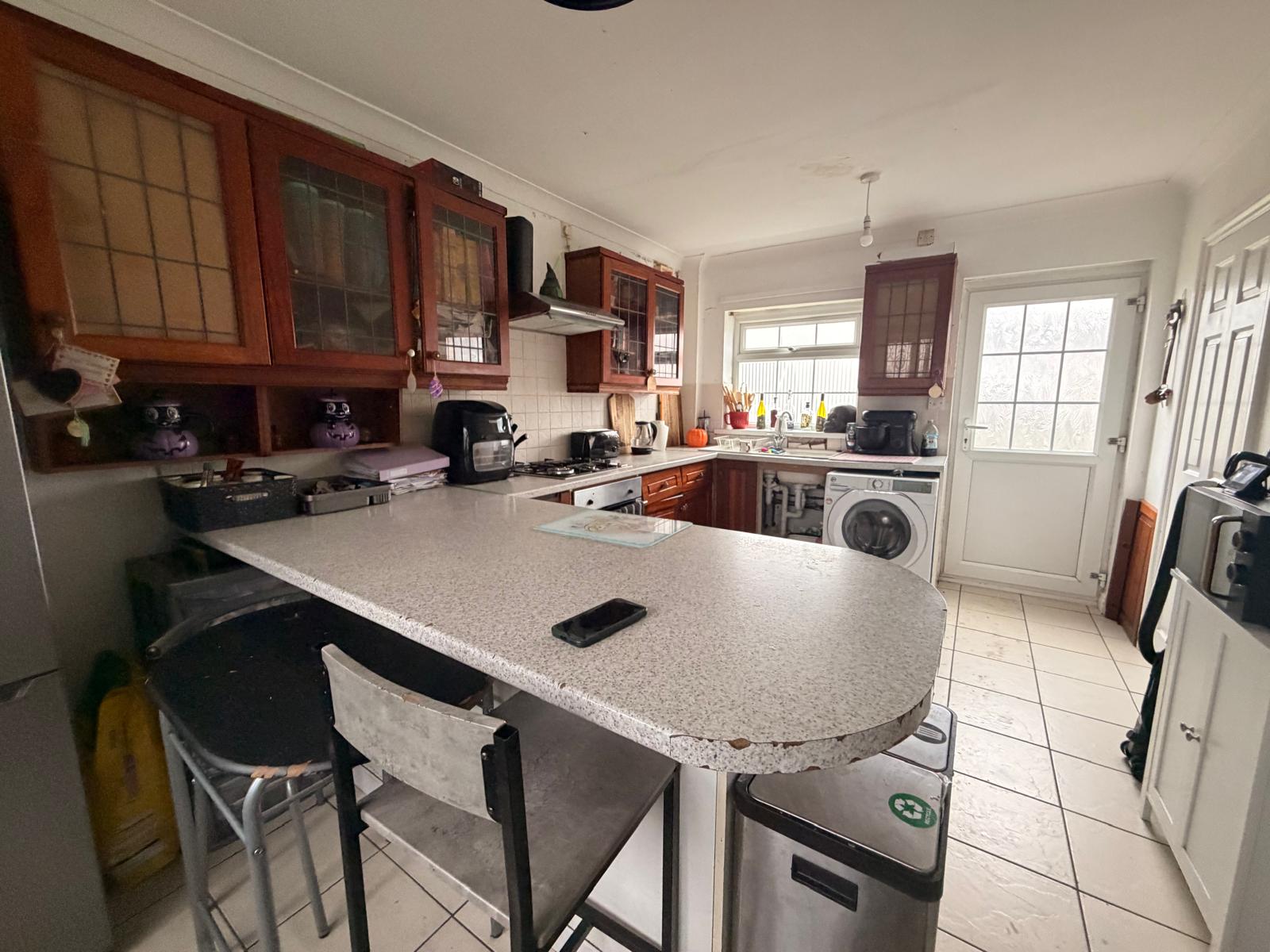 Kitchen in its original condition before refurbishment